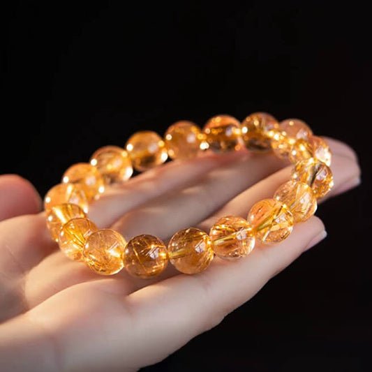 Golden yellow crystal bracelet with polished translucent beads
