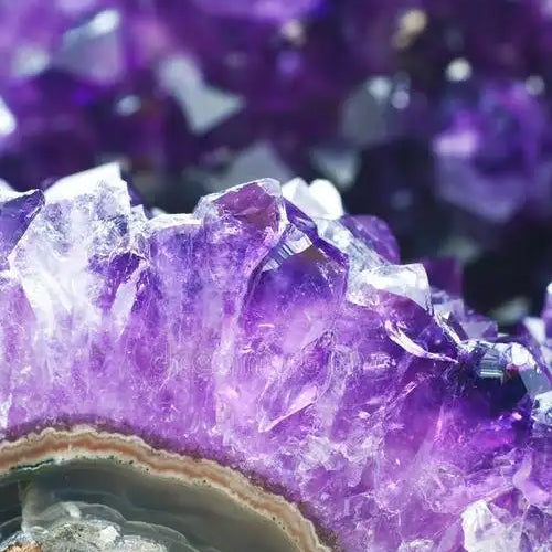 Natural purple amethyst crystal cluster with violet points