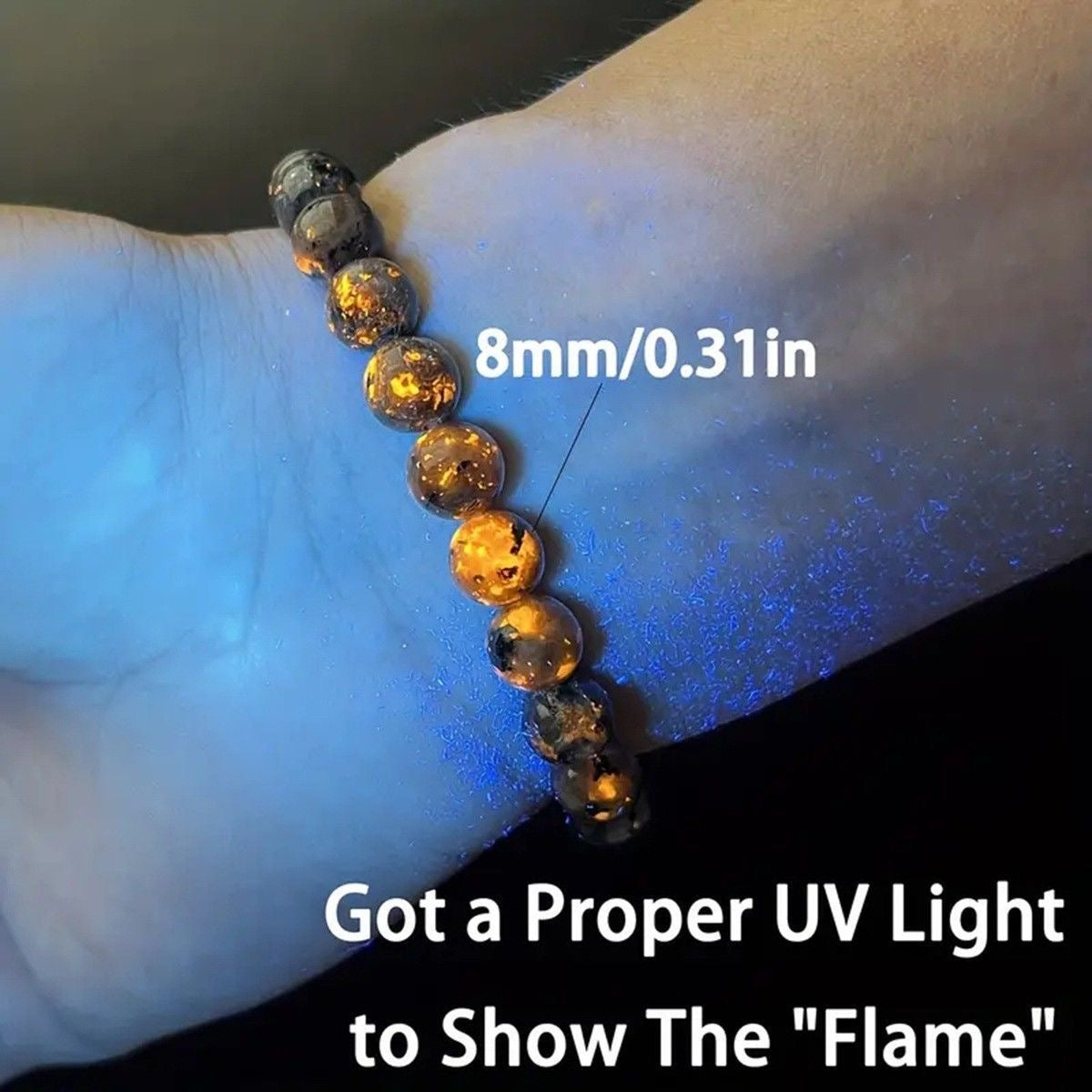 UV-reactive flame stone bracelet with approximately 8 mm beads worn on a wrist
