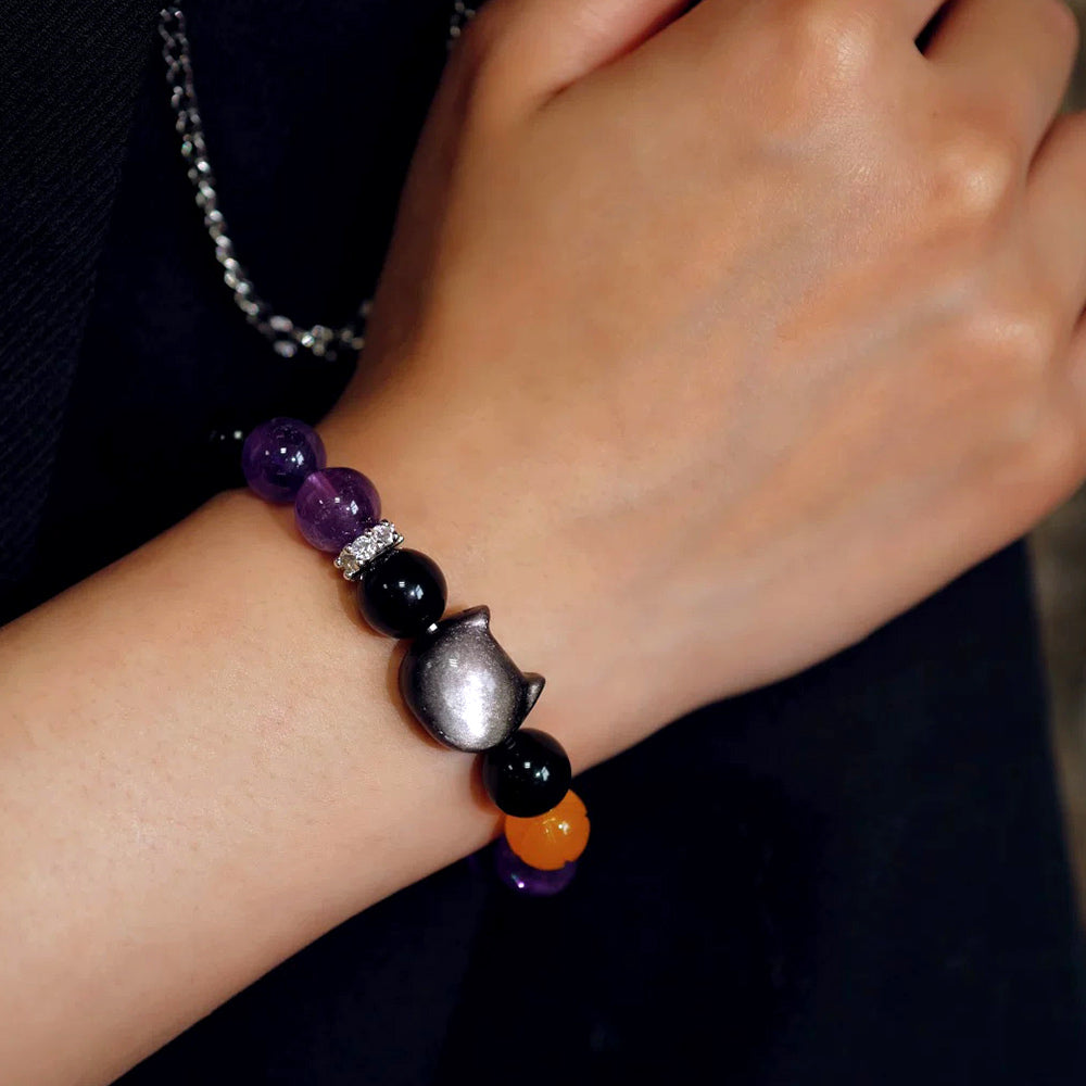 Midnight Familiar crystal cat bracelet worn on the wrist for scale