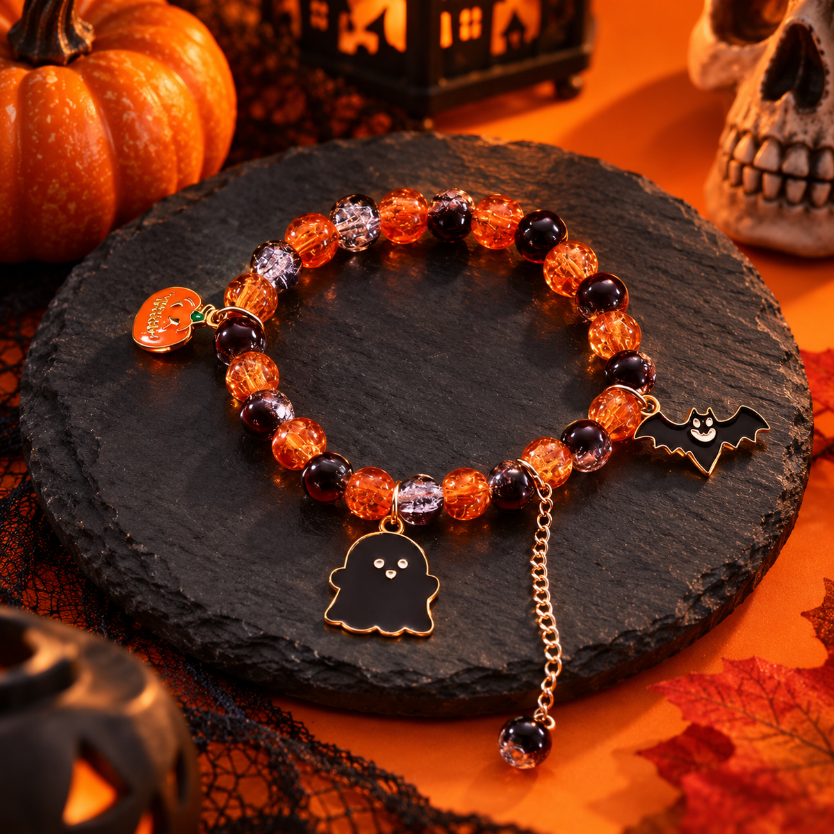 Styled concept scene of an orange ghost and bat Halloween bracelet