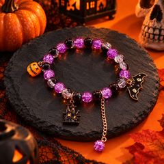 Styled concept scene of a purple haunted house and bat Halloween bracelet